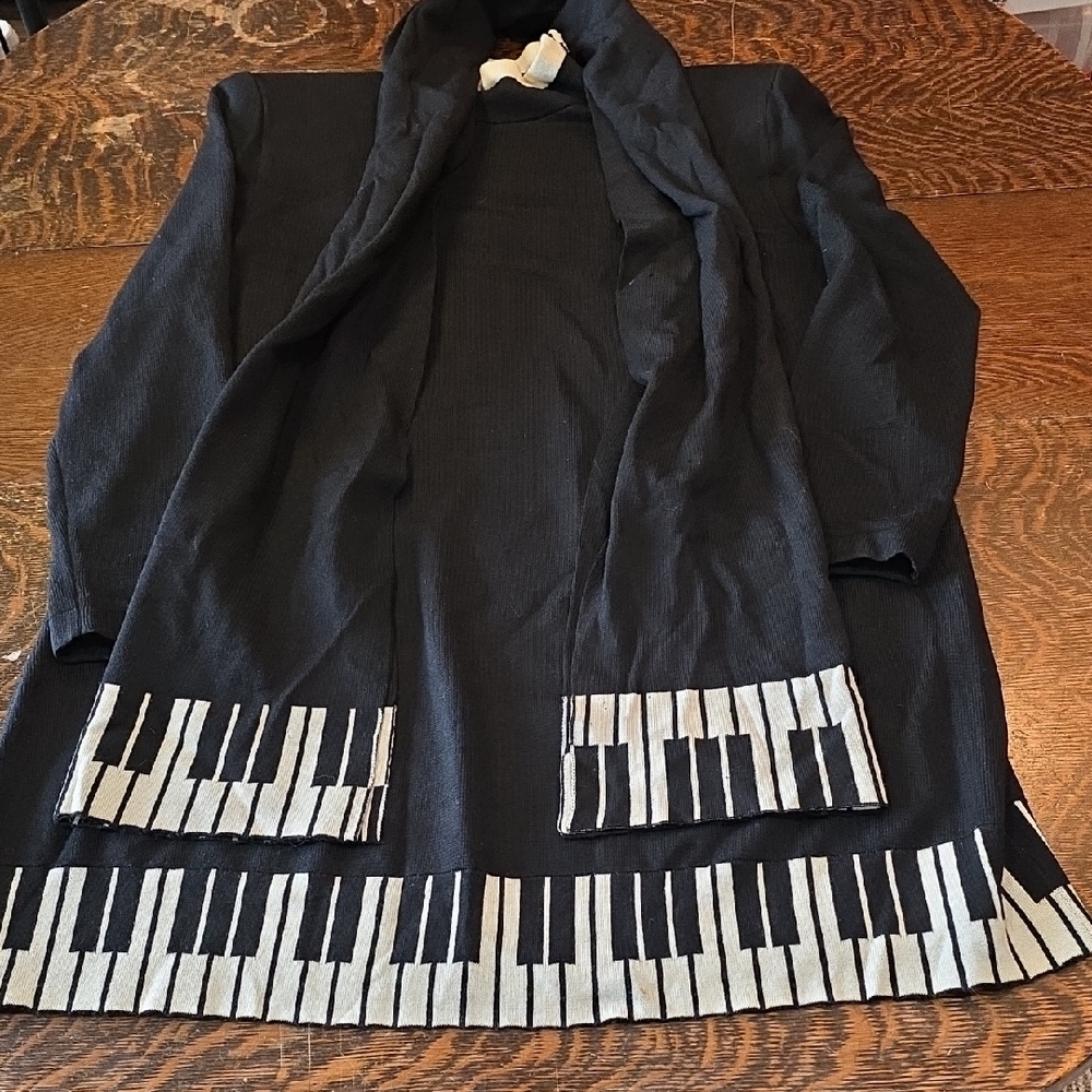 Vintage St. John knit sweater dress with a piano key print hem and matching scar